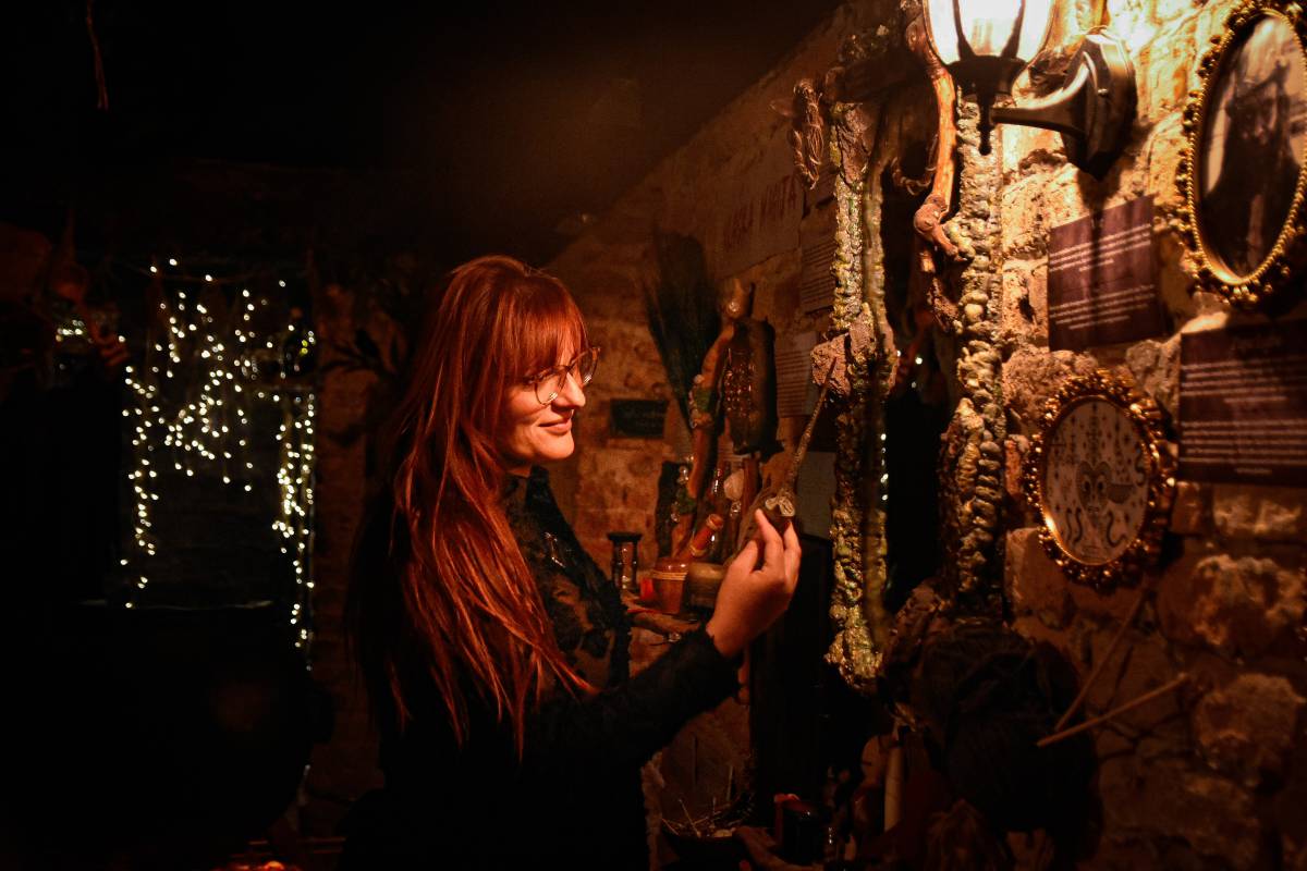 Mystical Artifacts and Talismans Visitor examining mystical artifacts and talismans at the Belgrade Paranormal Museum